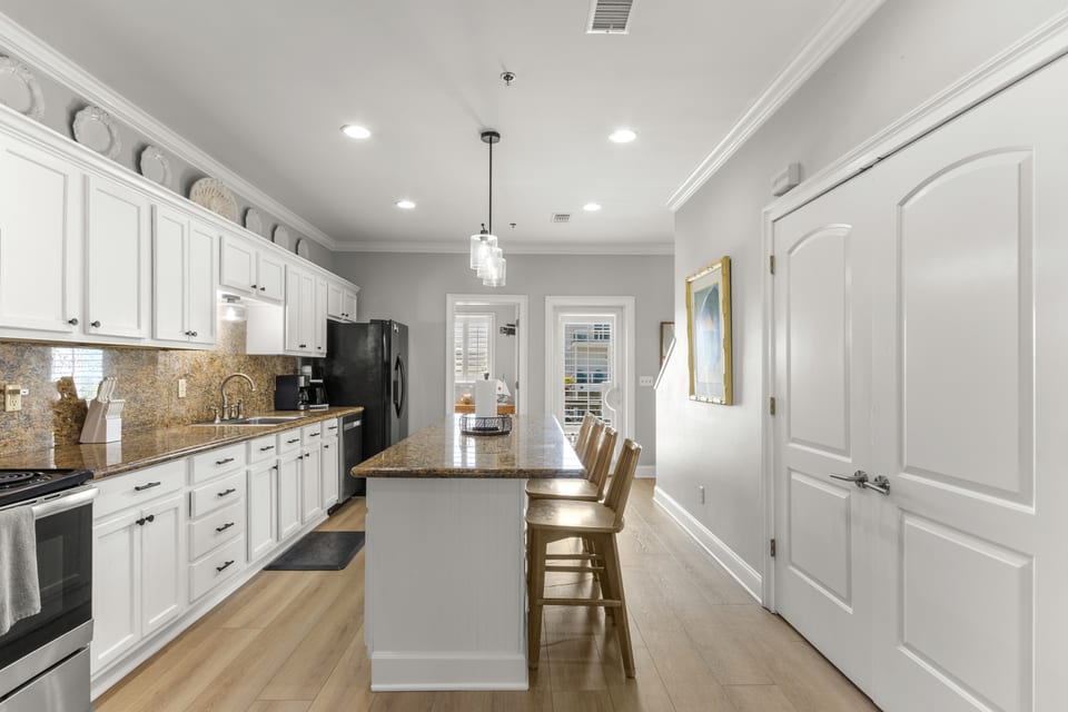 Full-height cabinetry and the run through to the living area